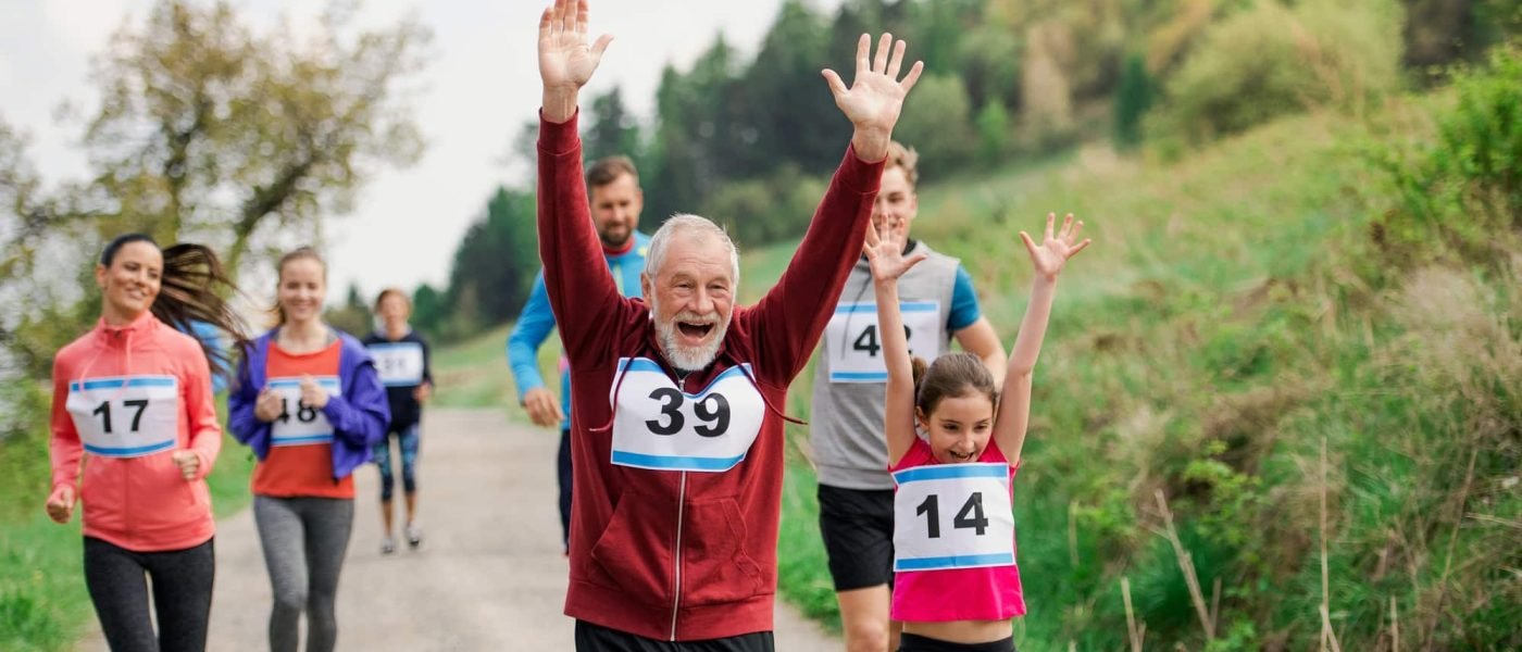 large-group-of-multi-generation-people-running-a-race-competition-in-nature-.jpg