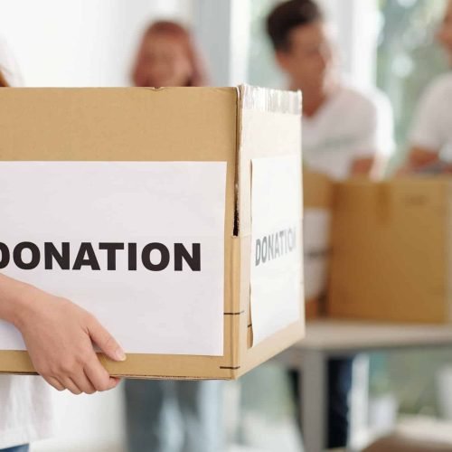 volunteer-holding-cardboard-box.jpg
